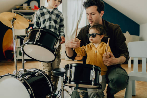 istock Dad and his boys playing drums together 1217584739