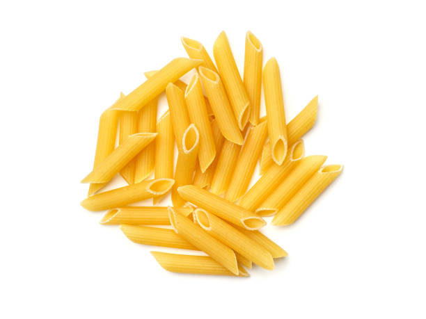 Pasta isolated on white background Penne Rigate pasta isolated on white background. Top view carbohydrate food type photos stock pictures, royalty-free photos & images