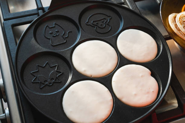 istock prepare pancakes on a pan with different shapes. template for a recipe 1217589320