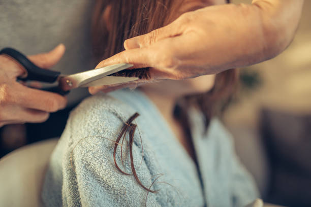 istock Mother cutting her son's hair at home 1217590896