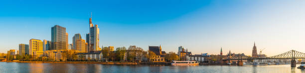 istock Frankfurt warm sunlight illuminating skyscrapers River Main waterfront panorama Germany 1217595308