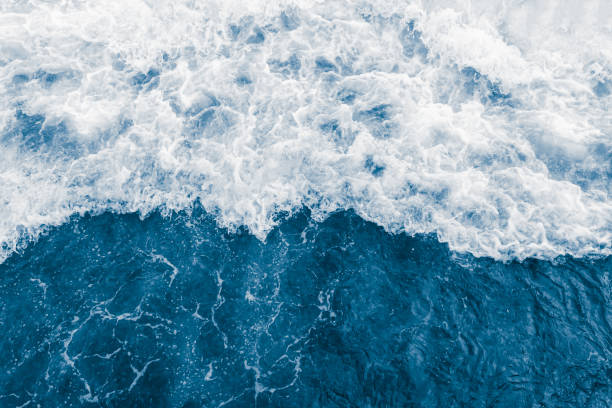 istock Dark blue ocean wave and white foam 1217595434