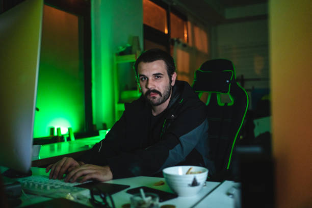 istock Portrait of a young hacker working on his computer 1217595774