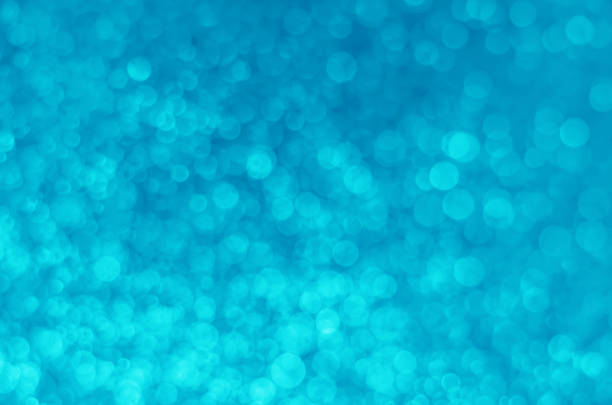 istock abstract blue bokeh glitter sparkle background. 1217597371