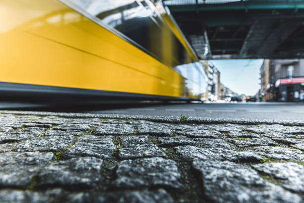 long exposure of yellow street car under metro bridge in Berlin Prenzlauer Berg