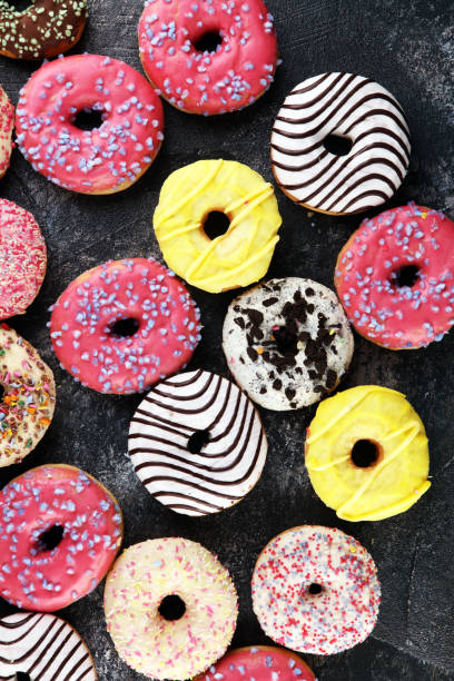 istock donuts in different glazes with chocolate, sprinkles and stripes 1217598131