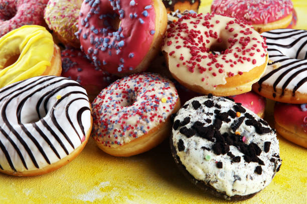 istock donuts in different glazes with chocolate, sprinkles and stripes 1217598227