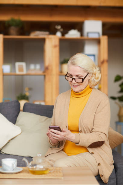 istock Senior woman with mobile phone 1217601864