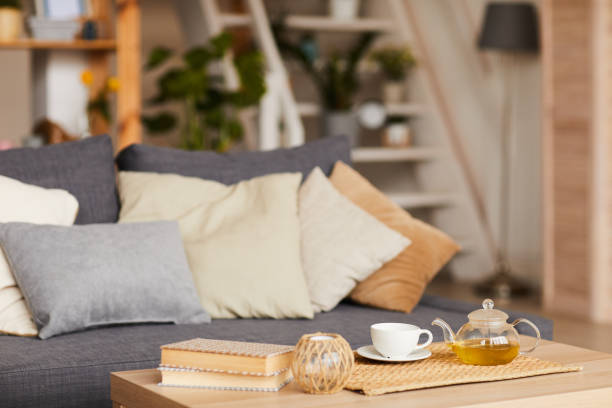 Image of domestic living room with table and cup of tea on it