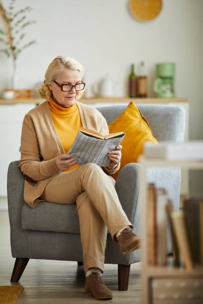 istock Senior woman reading a book 1217603445