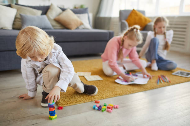 istock Little boy playing with toys 1217603530