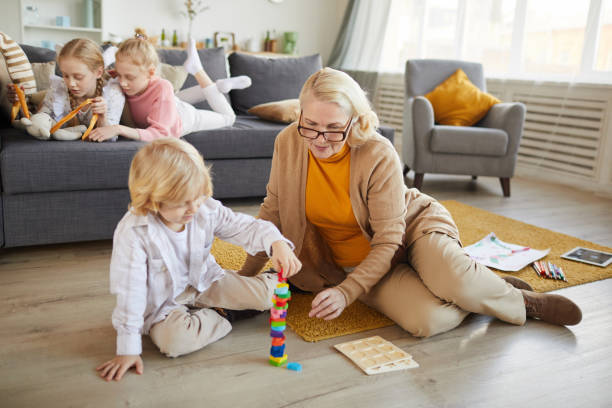 istock Little boy playing with grandmother 1217603659