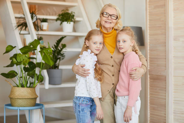 istock Grandmother with her granddaughters 1217604134
