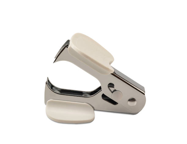 a white staple remover isolated on a white background with clipping path. - staple remover imagens e fotografias de stock