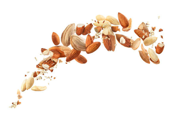 istock Almonds in the air on a white background 1217607271
