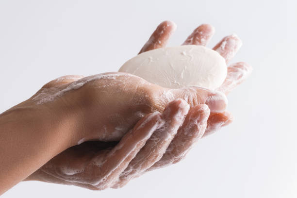 istock Close-up of female hands with a soap 1217611045