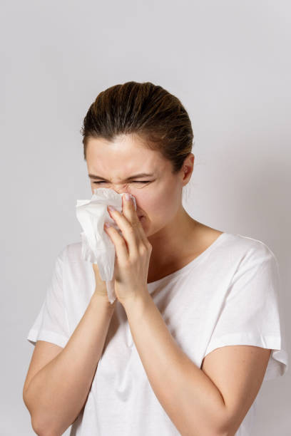 istock Young woman with a runny nose symptom 1217611857