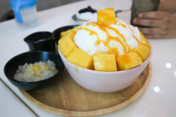 istock shave ice, shaved ice or snowflake ice with mango 1217613042