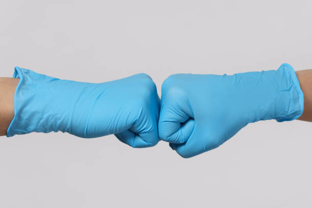 istock Two medical workers making a fist bump gesture. 1217614978