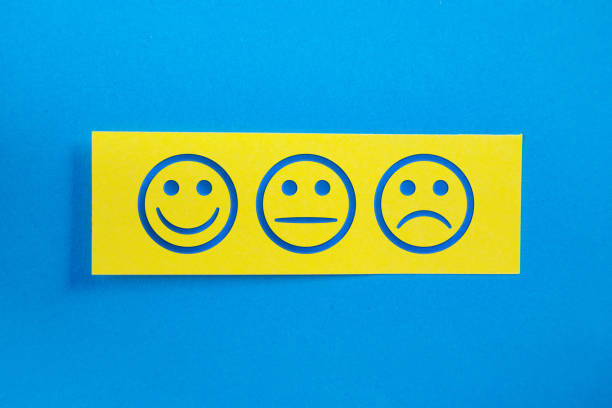 Yellow Sticky Paper With Customer Satisfaction Smily Face On Blue Background. Horizontal composition with copy space.