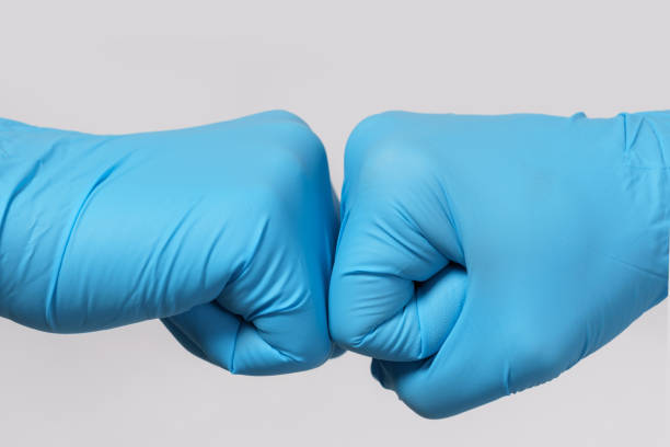 istock Two medical workers making a fist bump gesture. 1217615010