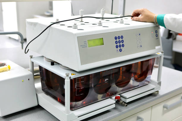 istock A female chemist conducts solubility tests of tablets and other dosage forms. Erveka - Scientific research pharmaceutical laboratory. A man conducts scientific work in a factory. Laboratory research 1217615173