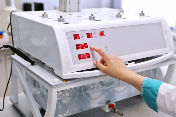 istock A female chemist conducts solubility tests of tablets and other dosage forms. Erveka - Scientific research pharmaceutical laboratory. A man conducts scientific work in a factory. Laboratory research 1217615208