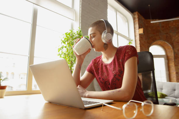 istock Woman working from home during coronavirus or COVID-19 quarantine, remote office concept 1217616428