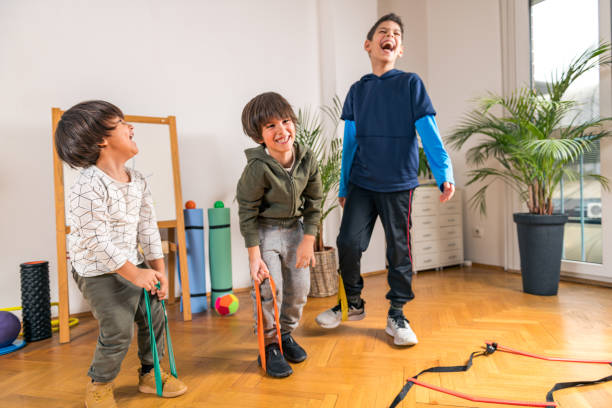 istock Children Exercising Resistance Bands Indoors 1217617176