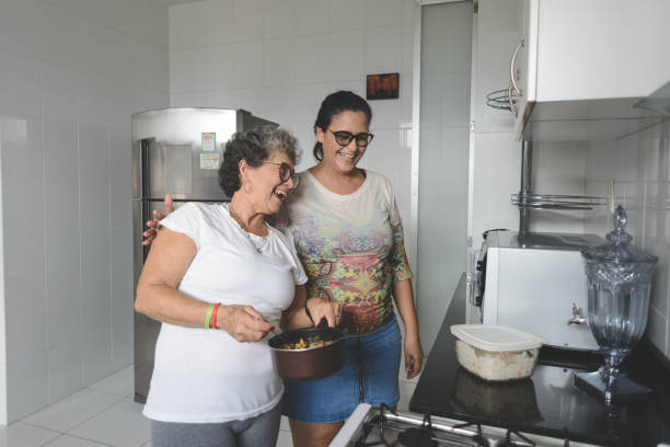 istock Mature women cooking at home 1217618305