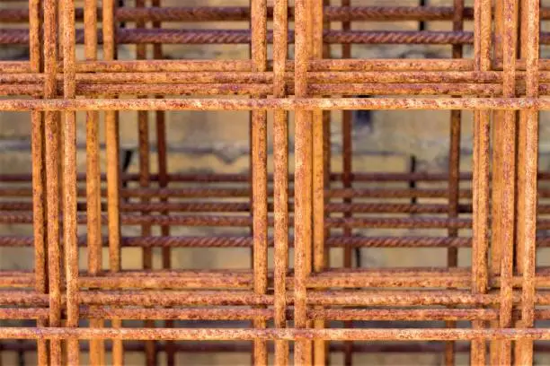 Steel wire mesh at construction site, rusty armature