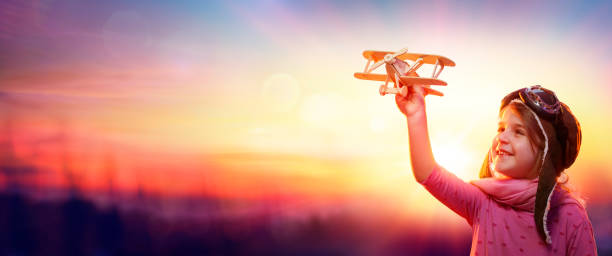 istock Child Pilot Aviator Play With Airplane At Sunset - Imagination And Freedom Concept 1217620752