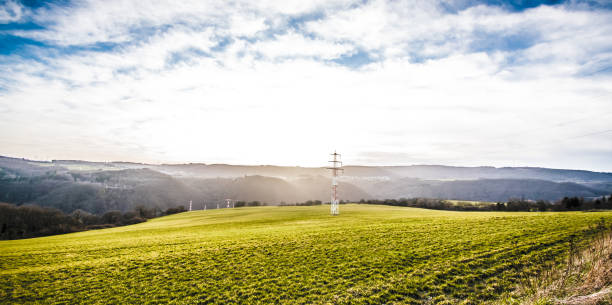istock Sunset in a mountain landscape with electricity pylons 1217622087