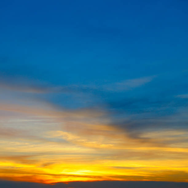 istock Cloudy sky and bright sun rise over the horizon. 1217625889