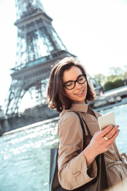 istock business woman in paris using the phone 1217628035