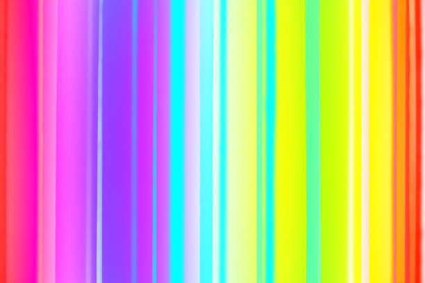 istock Striped background resembling barcode in rainbow colors. Jalousie (blinds) with dynamic colorful lighting. Modern interior fragment. Night club motif. Abstract spectrum image for science or technology issues. 1217629178