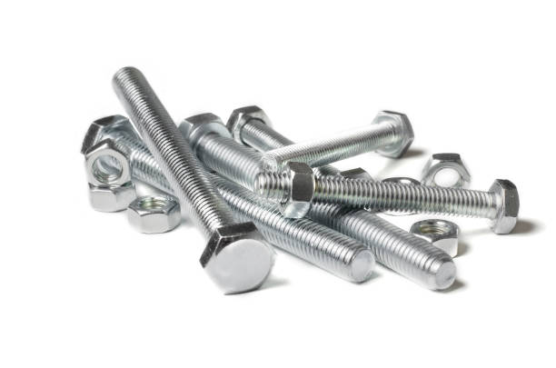 istock Lots of metal bolts and nuts. Tool for fixing. White background. Copy space 1217631274