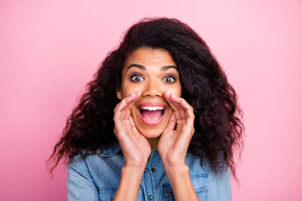 close up photo of crazy amazed afro american girl hear unbelievable information share sales discounts novelty scream wear denim jeans shirt isolated over pink color background - shirt women pink jeans imagens e fotografias de stock