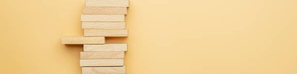 istock Wooden peg sticking out of a stack of them 1217632429