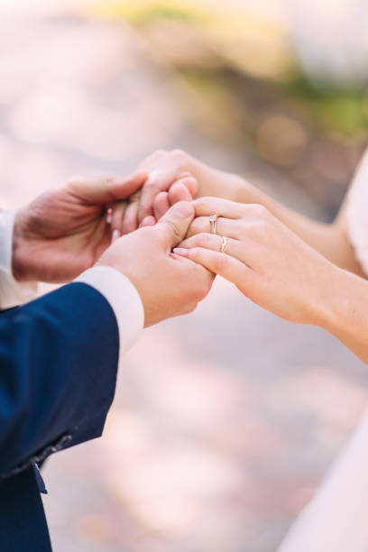 istock Wedding rings close-up. Wedding accessories bride and groom 1217633015