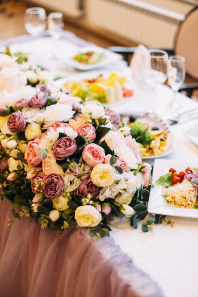 istock The decor of the wedding dinner. Wedding table setting. Dishes on the table in a restaurant. 1217633681