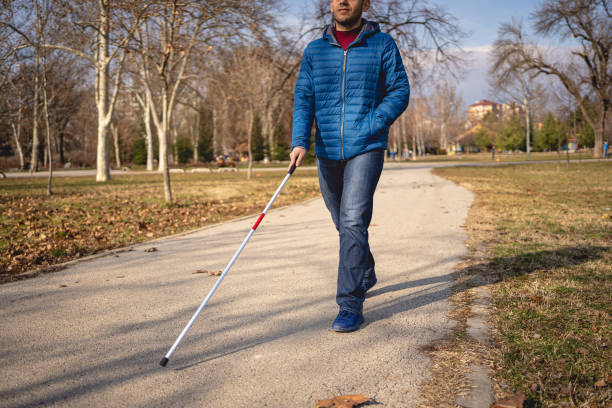 istock Young man with lost eyesight enjoying autumn walk 1217635007