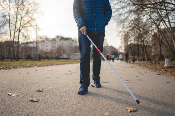 istock Blind man using walking cane to be sure there is no obstacle on his path 1217635395
