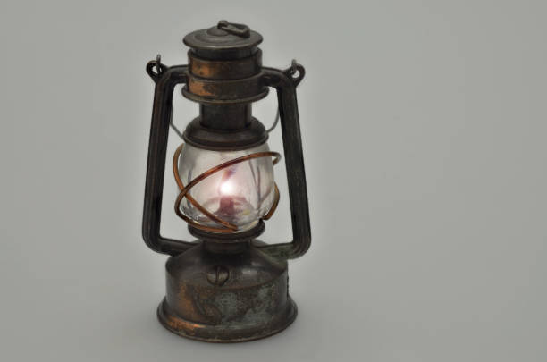 istock Retro Oil lamp, illuminated, isolated on gray Background, horizontal 1217637584