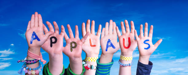 istock Children Hands Building Word Applause Means Applause, Blue Sky 1217638652