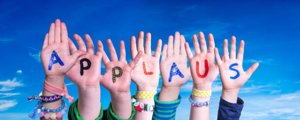 Children Hands Building Word Applause Means Applause, Blue Sky Children Hands Building Colorful German Word Applaus Means Applause. Blue Sky As Background applaus stock pictures, royalty-free photos & images