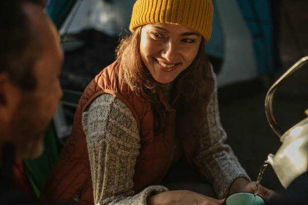 istock Couple camping in nature having coffee 1217640401