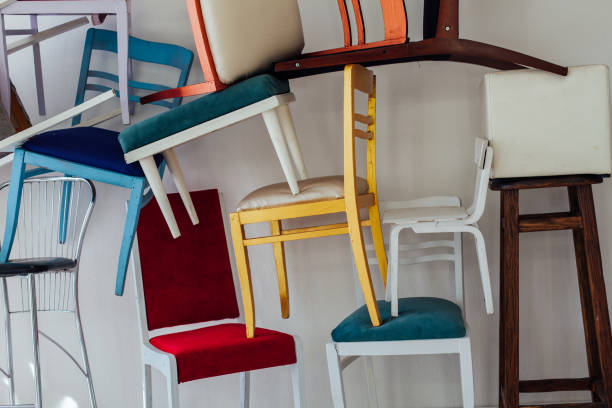 istock lots of different chairs in the empty white interior room 1217640558