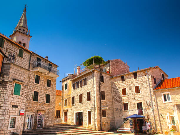 Jelsa townsquare Jelsa, Hvar island, Croatia - June 21st 2014:  Jelsa fishing town is an ideal destination for all those who are looking to benefit from the rich monumental heritage and natural beauties of Hvar island. jelsa stock pictures, royalty-free photos & images