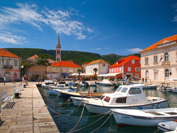 Jelsa port on Hvar island Jelsa, Hvar island, Croatia - June 21st 2014:  Jelsa fishing town is an ideal destination for all those who are looking to benefit from the rich monumental heritage and natural beauties of Hvar island. jelsa stock pictures, royalty-free photos & images